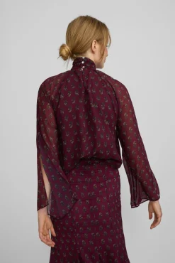 Blusa cuello estampado motivos