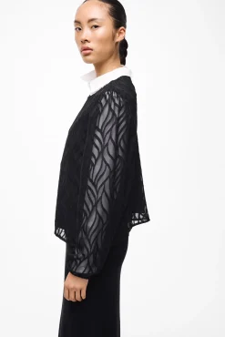 Blusa manga larga con cuello redondo
