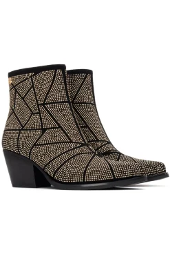 Botín cowboy tachas
