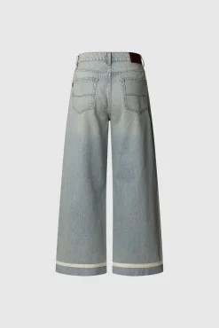 Pantalón denim wide leg con detalle en el bajo