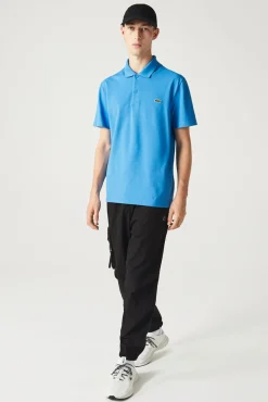 Polo con bordado de cocodrilo pespunteado